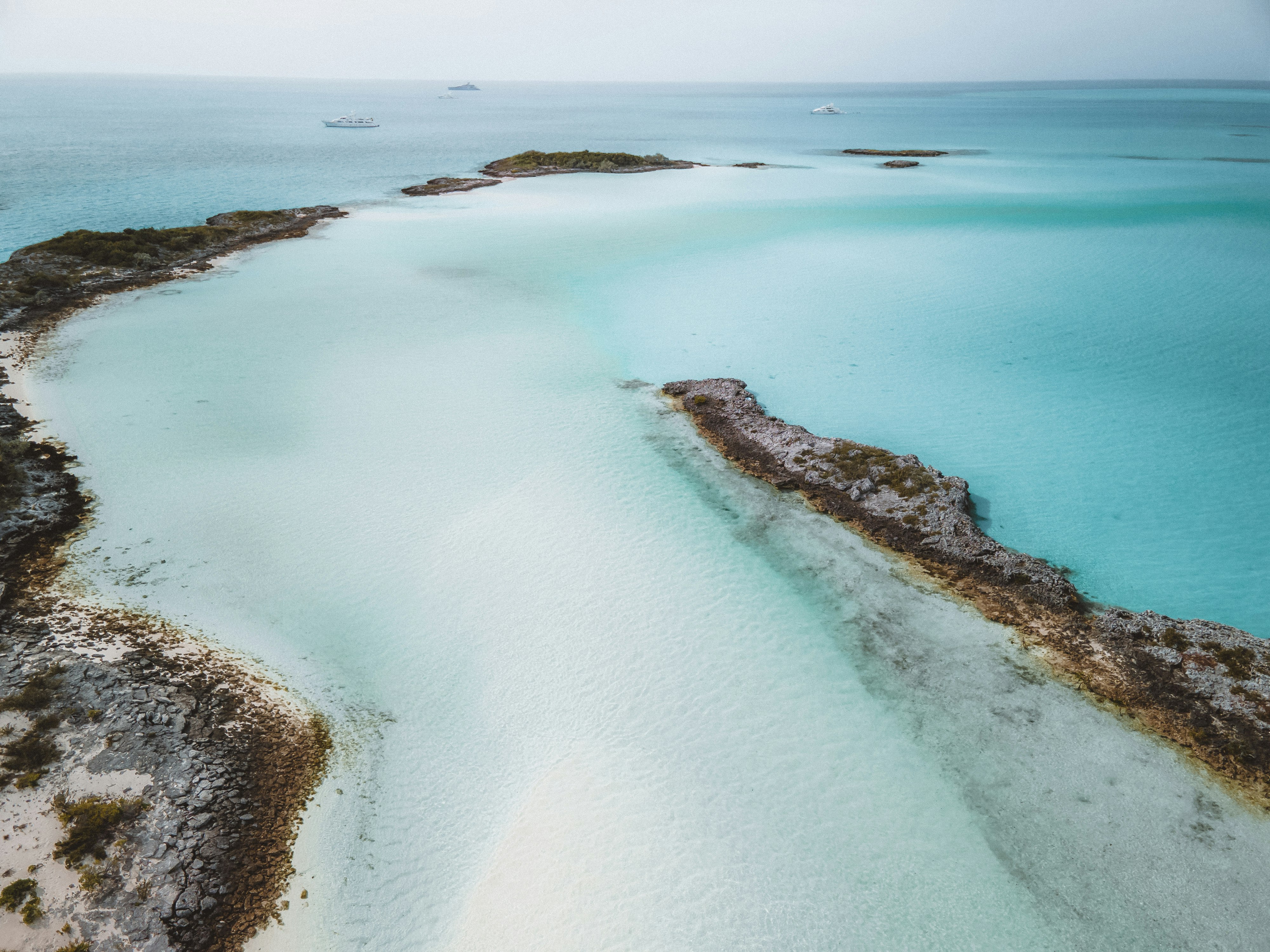 white sand beach during daytime